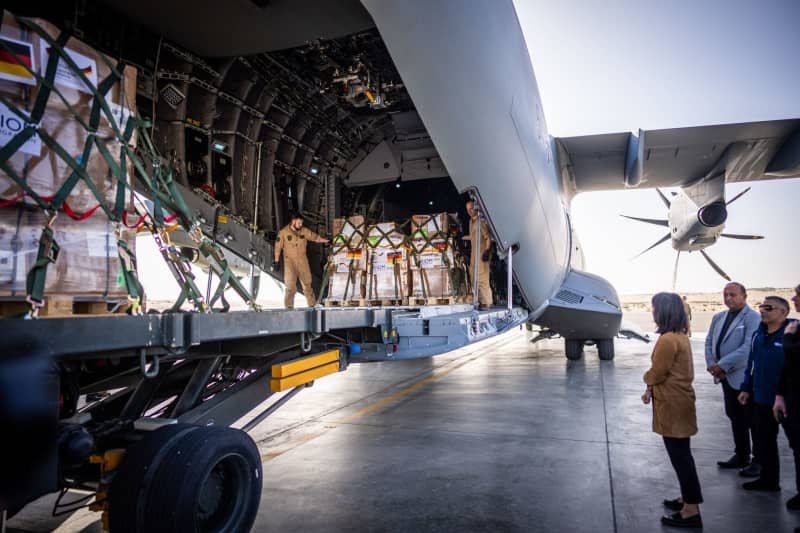 German Foreign Minister, Annalena Baerbock stands in front of an A400M German Air Force plane with aid supplies for Gaza. Michael Kappeler/dpa