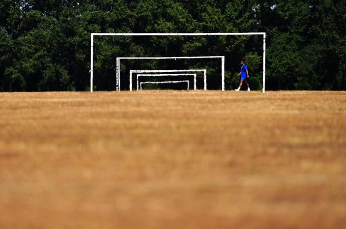 Dry grass on the football pitches at Hackney Marshes (Victoria Jones/PA) (PA Wire)