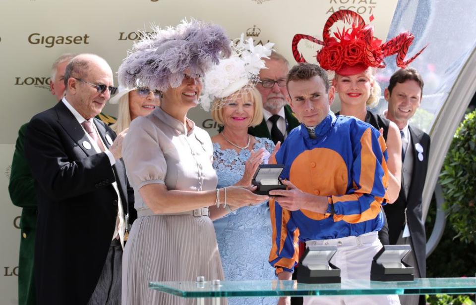 Sophie Countess of Wessex presents winning jockey Ryan Moore with the an award for winning the Ribblesdale Stakes on Magic Wand during Day 3 of Royal Ascot.