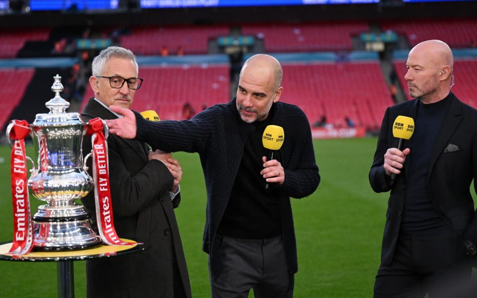 Gary Lineker and Alan Shearer speak to Pep Guardiola with the FA Cup trophy after Man City's victory in the semi final against Chelsea at Wembley