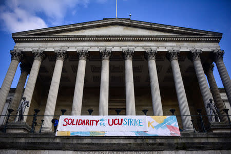 A banner supporting lecturer strikes is displayed outside the University College of London, Britain February 22, 2018. REUTERS/Peter Summers