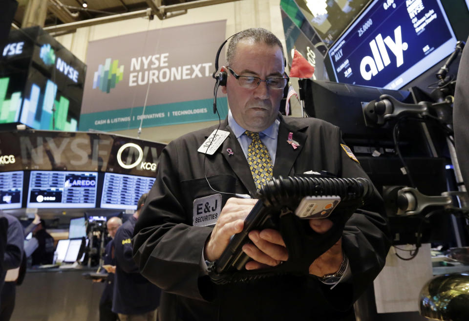 Trader John Yaccarine works on the floor of the New York Stock Exchange Thursday, April 10, 2014. U.S. stock indexes are slipping lower in early trading Thursday as investors pick over a mixed batch of corporate earnings reports. (AP Photo/Richard Drew)