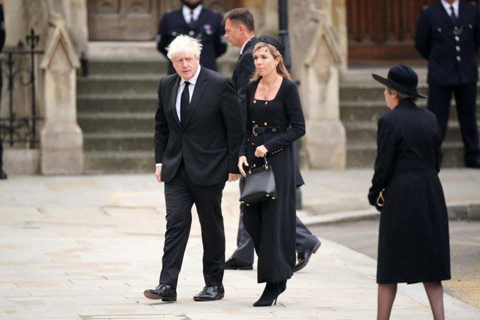 Former prime ministers Theresa May (right) and Boris Johnson with his wife Carrie Johnson arriving at the State Funeral of Queen Elizabeth II, held at Westminster Abbey, London. Picture date: Monday September 19, 2022. (Photo by Peter Byrne/PA Images via Getty Images)