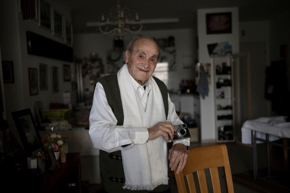 Gad Partok, 93, a Tunisian-born Holocaust survivor, poses for a portrait in his home in Ashkelon, southern Israel, Friday, Jan. 26, 2024. He never thought he'd have to relive the horrors of the Nazi onslaught that claimed the lives of his father and two brothers.Then, on Oct. 7, he watched on TV from his living room as Israeli news channels played videos of Hamas militants tearing through communities just a few kilometers (miles) from where he lives. He took cover as rocket fire from Gaza pounded Ashkelon, the southern Israeli city he moved to after emigrating from Tunisia in 1947.