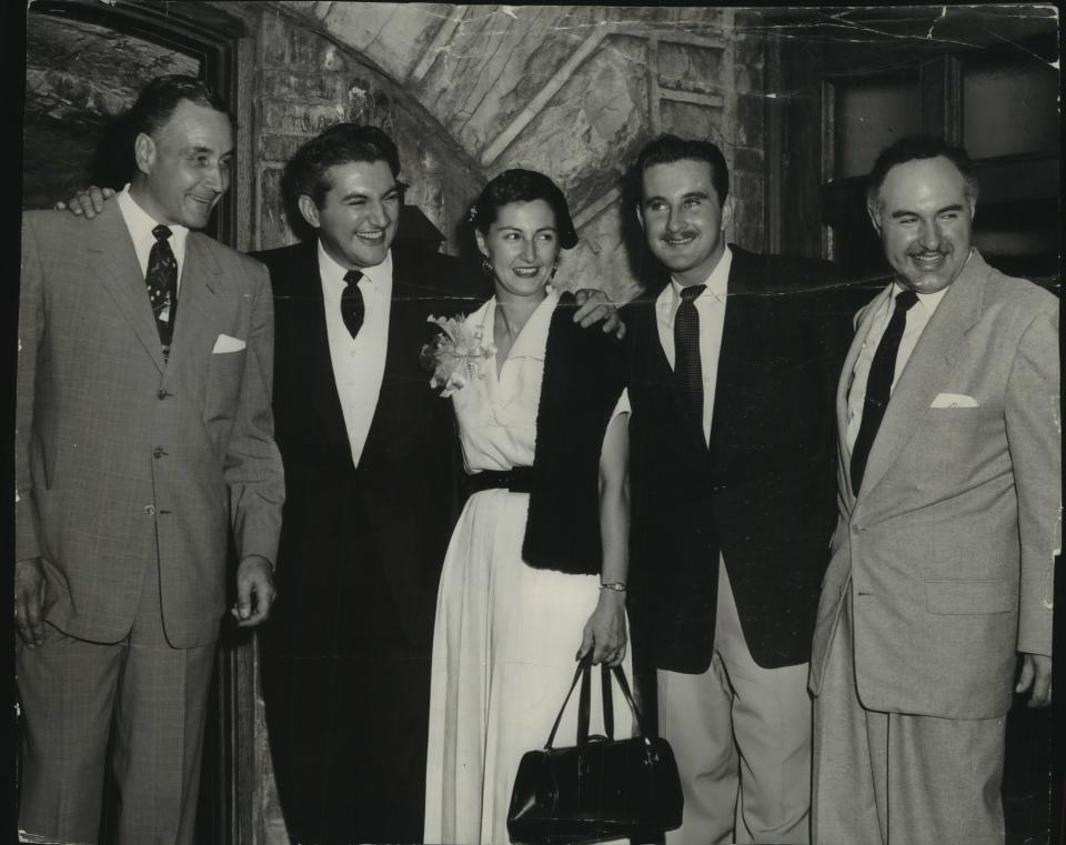 Miller Brewing Co. president Frederick C. Miller (from left) poses with Liberace, his sister Angelina and brothers Rudolph and George. Liberace and family were visiting the recently opened Miller Caves museum at the Milwaukee brewery. This photo was taken in October 1953; Liberace made an appearance at the Caves' "premiere" as a museum on Oct. 19, 1953.