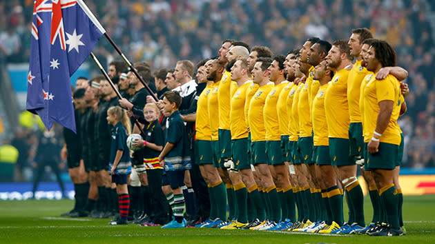 Both teams line up for the national anthems.