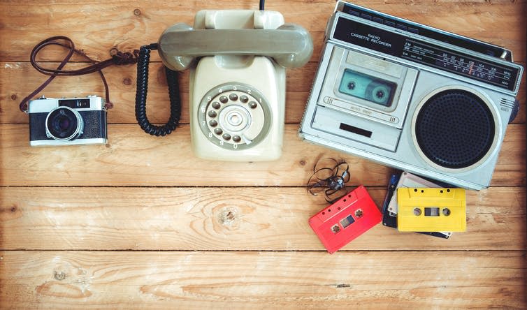 A cassette recorder, and old style telephone.