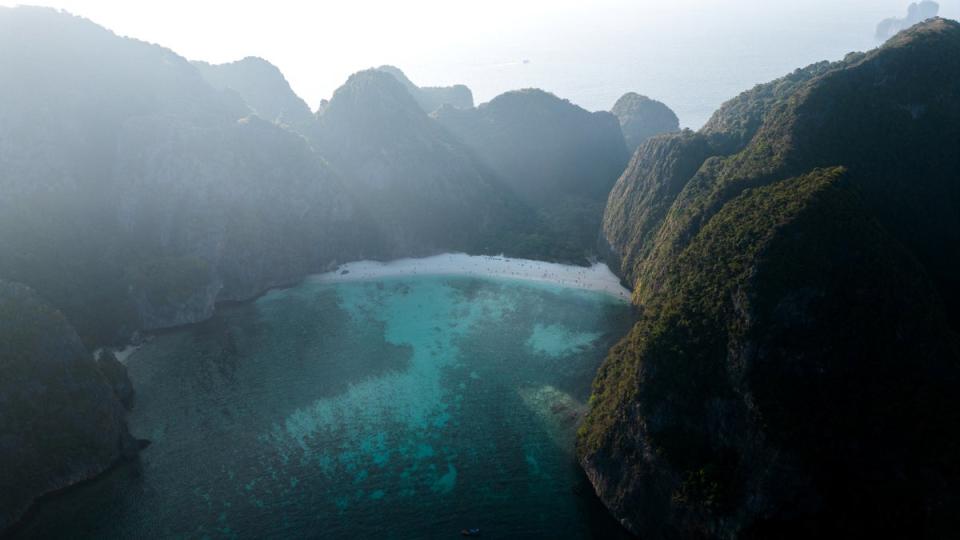 The sun rises over Maya Bay's limestone mountains at the Phi Phi Island (Reuters)