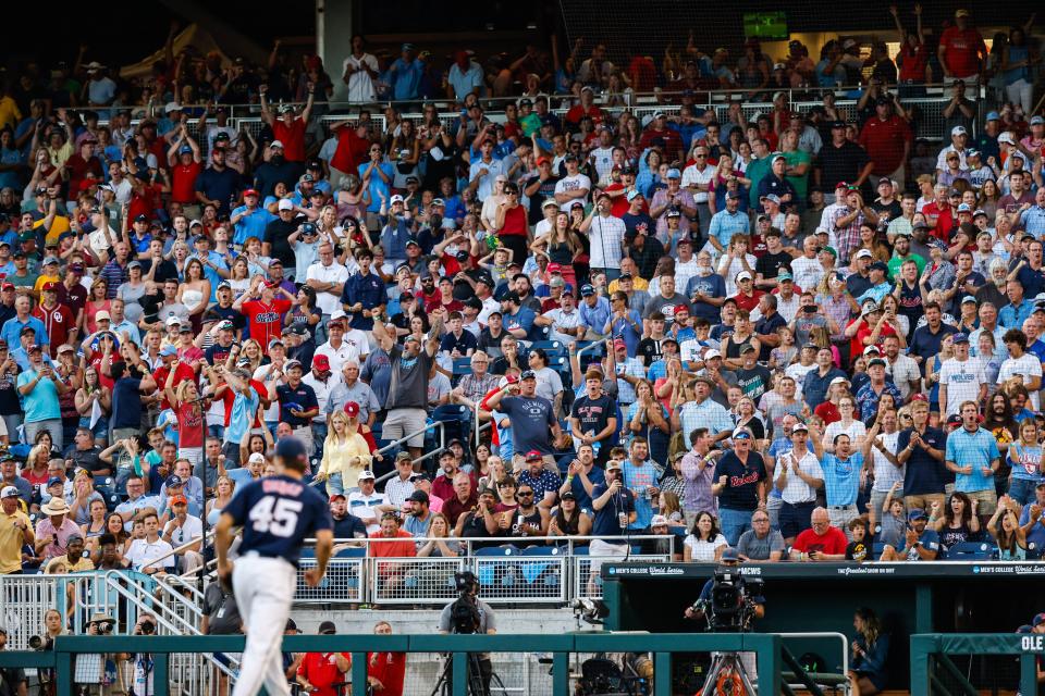 Jun 25, 2022; Omaha, NE, USA;  Fans react after Ole Miss pitcher Mason Nichols (45) walks off the mound during the seventh inning at Charles Schwab Field. Mandatory Credit: Jaylynn Nash-USA TODAY Sports