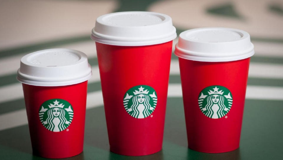 <p>Last year’s infamous plain red cups [Photo: Starbucks] </p>