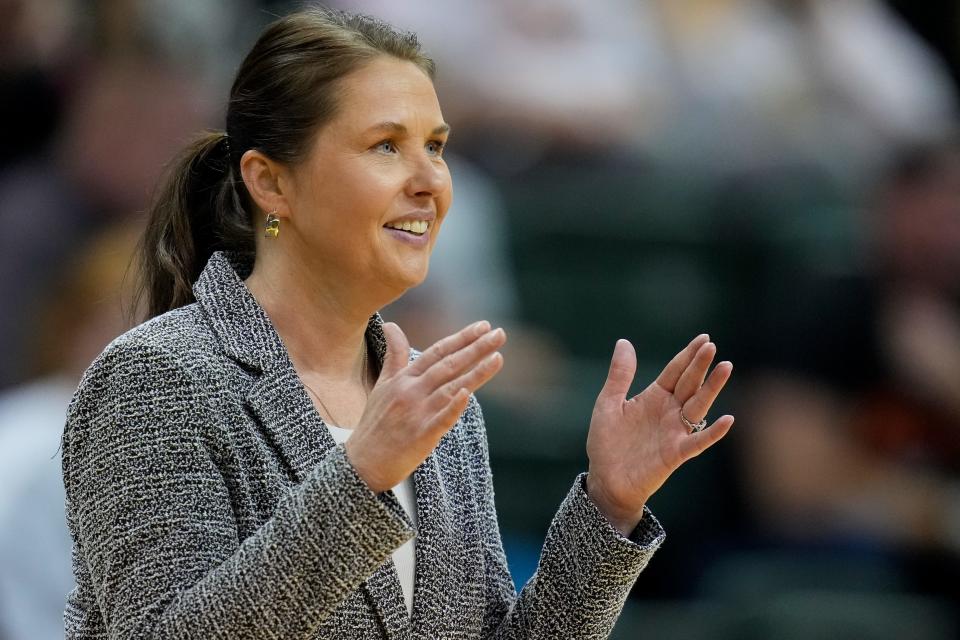 Marlington head coach Stephanie Tortola signals to her team in the first set Thursday.