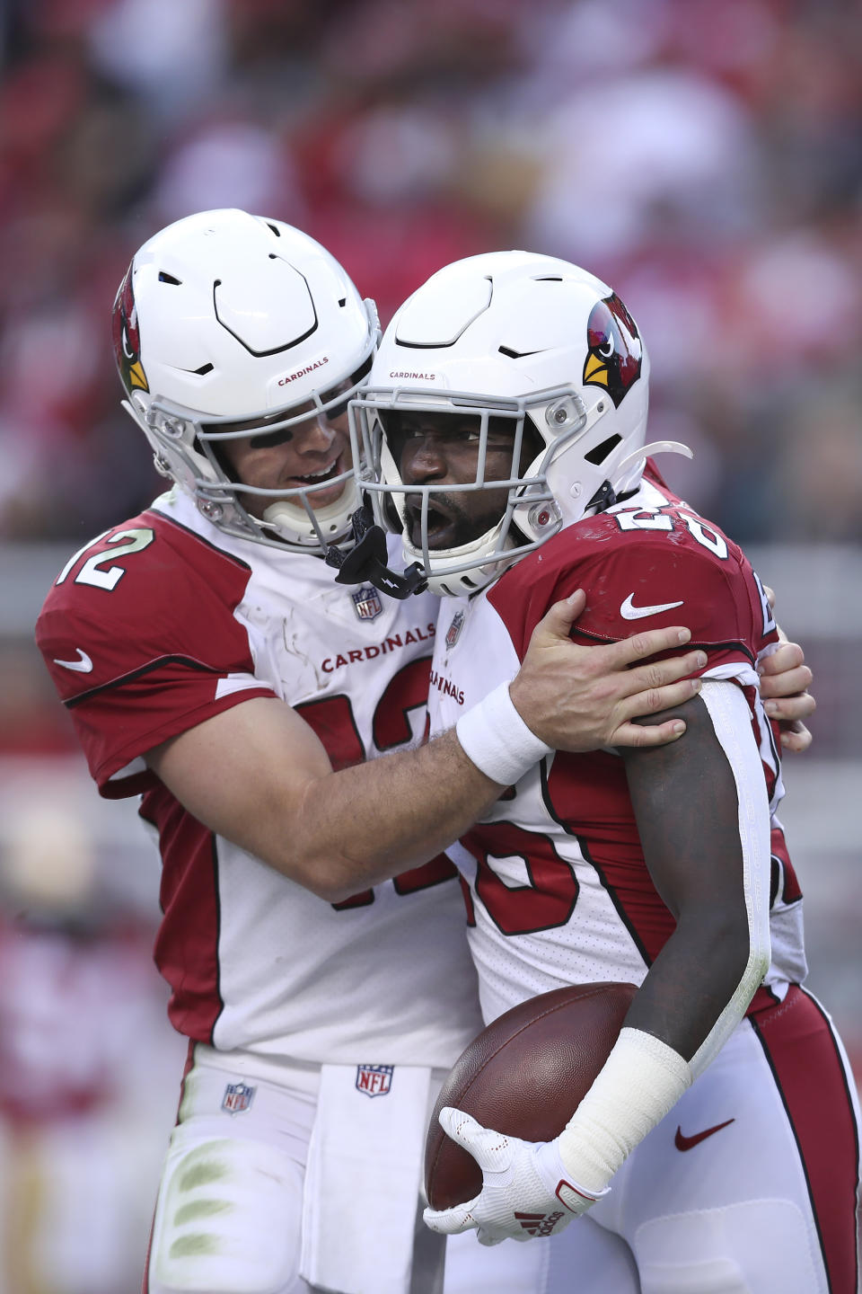 Arizona Cardinals running back Eno Benjamin, right, celebrates with quarterback Colt McCoy after scoring against the San Francisco 49ers during the second half of an NFL football game in Santa Clara, Calif., Sunday, Nov. 7, 2021. (AP Photo/Jed Jacobsohn)