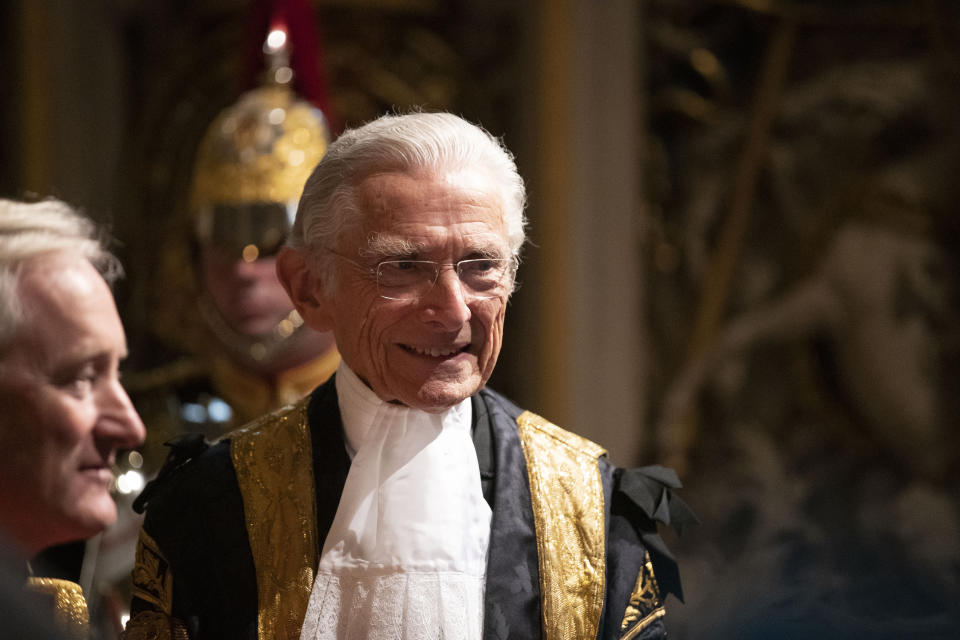 Lord Speaker Norman Fowler speaks to dignitaries in the Norman Porch at the Palace of Westminster and the Houses of Parliament at the State Opening of Parliament ceremony in London, Monday, Oct. 14, 2019. (AP Photo/Matt Dunham, Pool)