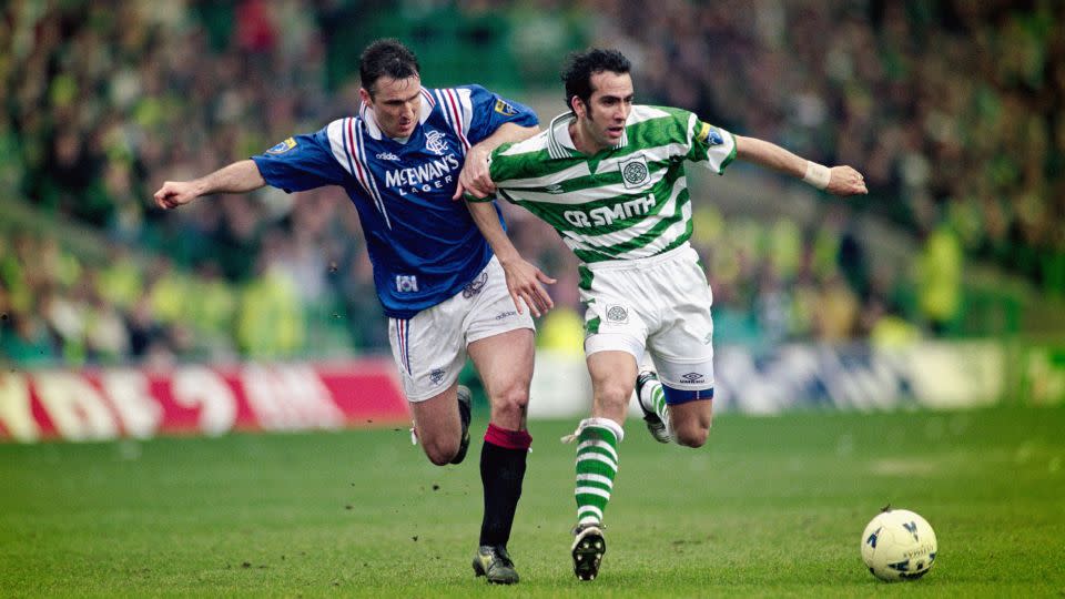 Rangers player Ian Ferguson (left) challenges Paolo Di Canio of Celtic during an Old Firm on March 16, 1997, in Glasgow, Scotland. - Shaun Botterill/Allsport/Getty Images