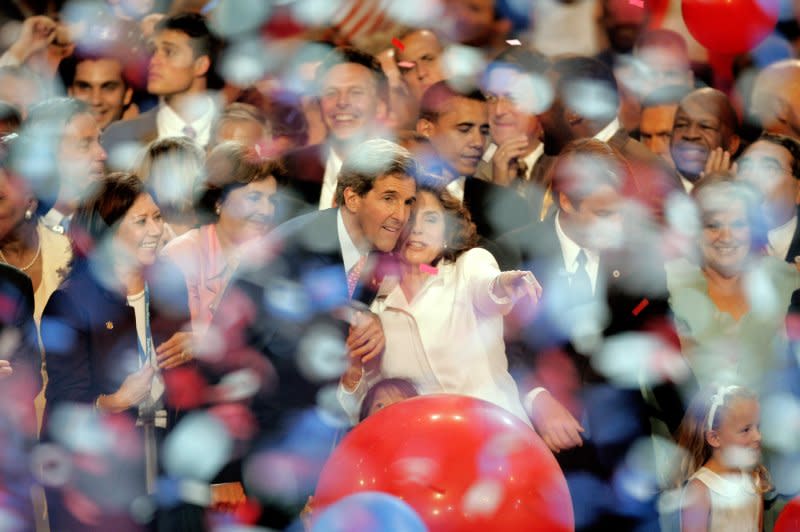 Democratic presidential candidate John Kerry stands with his wife Teresa Heinz Kerry after he spoke to the delegations on Day 4 of the Democratic National Convention at the FleetCenter in Boston on July 29, 2004. File Photo by Terry Schmitt/UPI