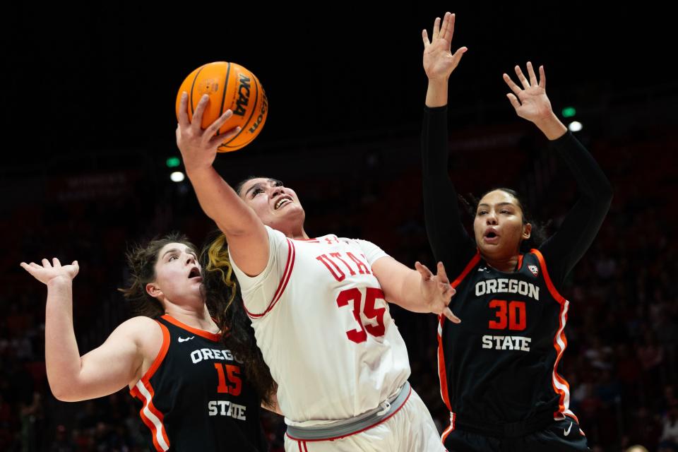 Utah Utes forward Alissa Pili (35) shoots the ball with Oregon State Beavers forward Raegan Beers (15) and Oregon State Beavers forward Timea Gardiner (30) on defense during the women’s college basketball game between the Utah Utes and the Oregon State Beavers at the Jon M. Huntsman Center in Salt Lake City on Friday, Feb. 9, 2024. | Megan Nielsen, Deseret News