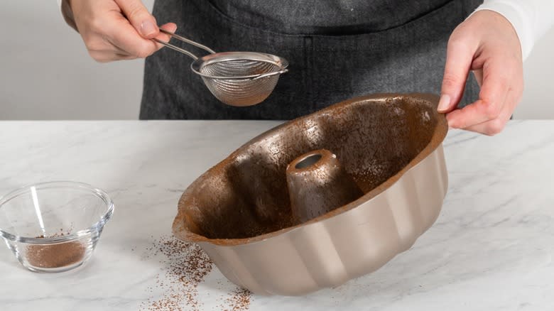 Coating a Bundt pan with cocoa powder