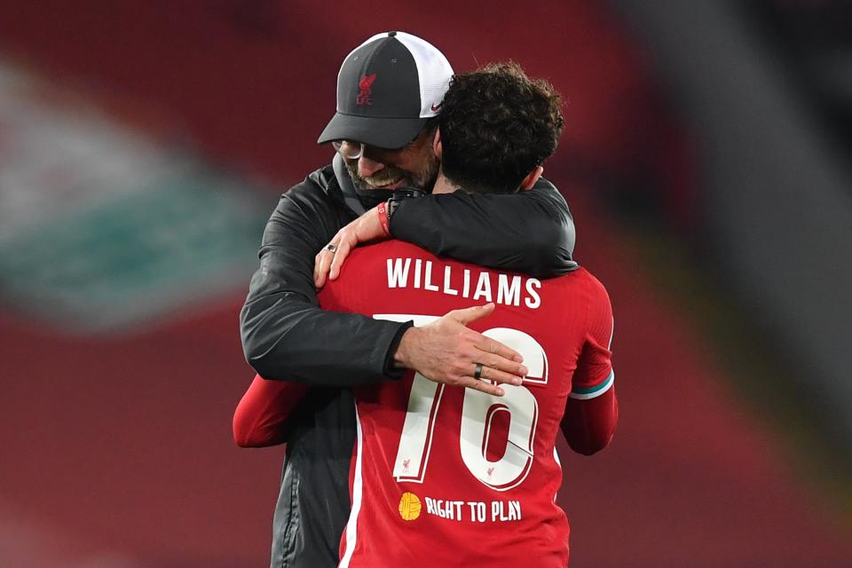 Neco Williams embraces Jurgen Klopp after Liverpool defeat AjaxPOOL/AFP via Getty Images