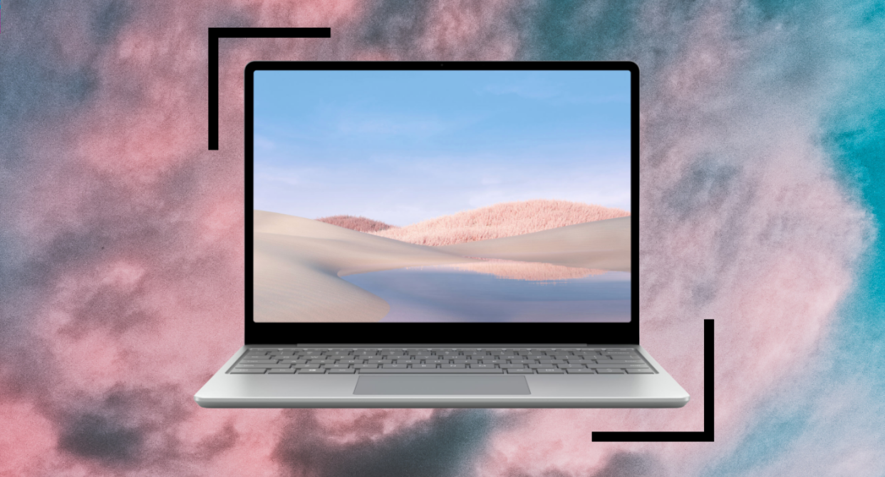 microsoft surface laptop on pink and blue clouds 