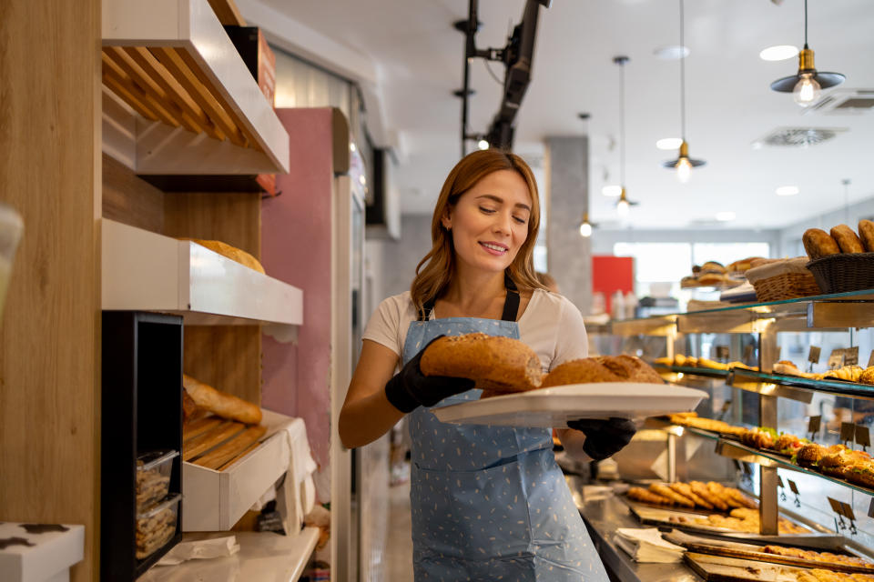A female baker in her element, showcasing her passion and the artisanal essence of the bakery