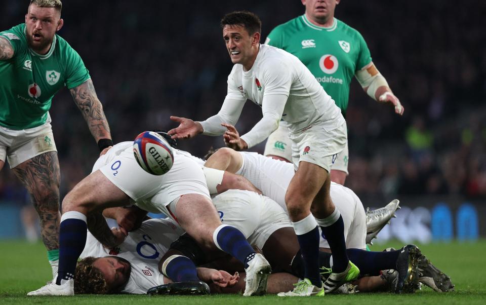 England's scrum half Alex Mitchell offloads the ball during the Six Nations international rugby union match between England and Ireland at Twickenham Stadium in south-west London, on March 9, 2024.