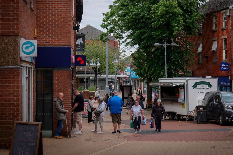 Sutton-in-Ashfield's town centre with shoppers seen in the high street