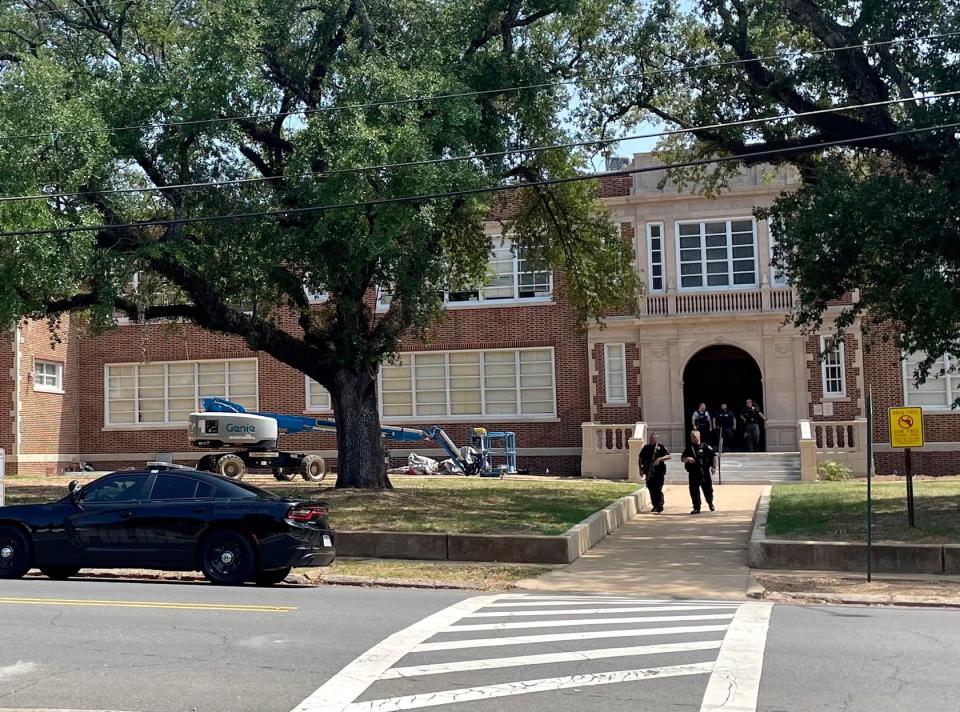 Shreveport Police and Caddo Parish Sheriff deputies investigate a report of a suspicious person Wednesday near Byrd High School.