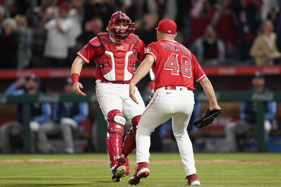 Los Angeles Angels starting pitcher Reid Detmers (48) celebrates with catcher Chad Wallach (35) after throwing a no hitter against the Tampa Bay Rays in a baseball game in Anaheim, Calif., Tuesday, May 10, 2022. The Angels won 12-0. (AP Photo/Ashley Landis)