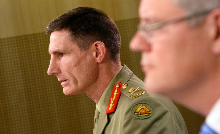 Lieutenant General Angus Campbell (L), commander of the federal government's Operation Sovereign Borders policy, in Sydney on September 23, 2013