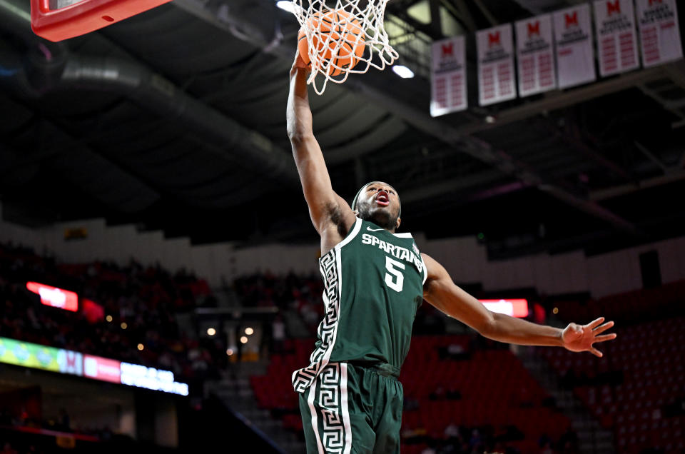 COLLEGE PARK, MARYLAND – JANUARY 21: Tre Holloman #5 of the Michigan State Spartans dunks the ball in the first half against the Maryland Terrapins at Xfinity Center on January 21, 2024 in College Park, Maryland. (Photo by Greg Fiume/Getty Images)