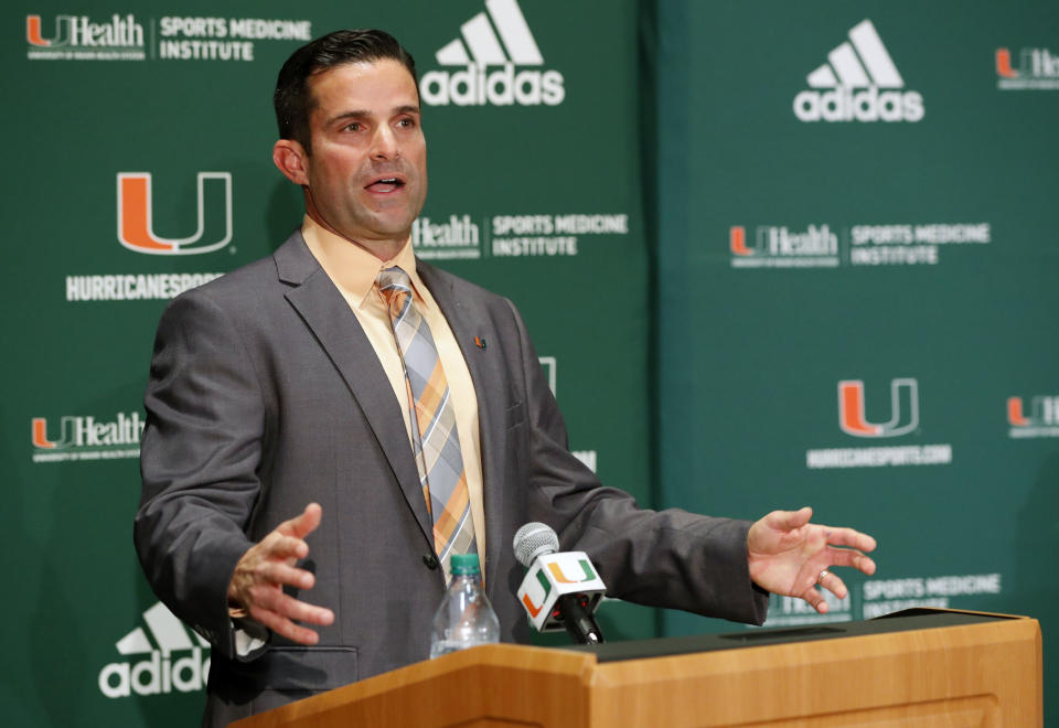 FILE - In this Wednesday, Jan. 2, 2019 file photo, Manny Diaz speaks during a news conference after being named Miami's new NCAA college football head coach in Coral Gables, Fla. Florida State and Miami were hoping signing day could help put to the negativity of 2018 to rest and provide a push toward better times. Miami, coming off a 7-6 season and coach Mark Richt's surprising retirement, managed to finally provide some good news for Hurricanes fans. New coach Manny Diaz bolstered the 'Canes recruiting class with some high-profile transfers. (AP Photo/Wilfredo Lee, File)