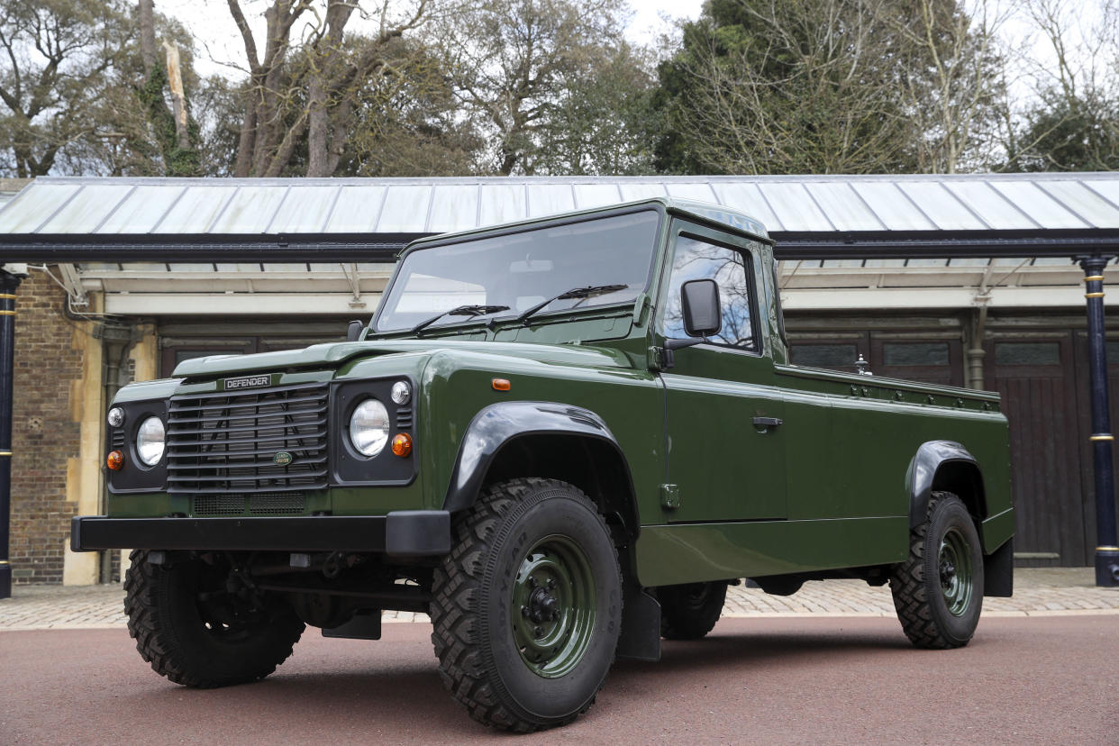 The Land Rover Defender that will be used to transport the coffin of Britain's Prince Philip, Duke of Edinburgh during the funeral procession is parked in Windsor Castle, Windsor on April 14, 2021. - The modified Land Rover Defender TD5 130 chassis cab vehicle was made at Land Rover's Solihull factory in 2003 and the Duke oversaw the modifications requesting a repaint in military green and designing the open top rear and special 