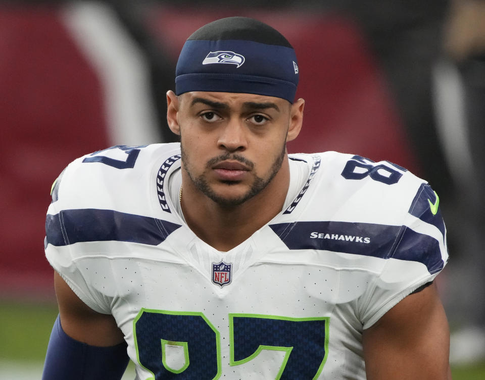 FILE - Seattle Seahawks tight end Noah Fant looks on during the first half of an NFL football game against the Arizona Cardinals, Jan. 8, 2024, in Glendale, Ariz. The Seahawks agreed to terms with Fant and defensive lineman Leonard Williams, two people with knowledge of the deals said Monday, March 11, 2024. They spoke to The Associated Press on the condition of anonymity because the team had not announced either signing. (AP Photo/Rick Scuteri, File)