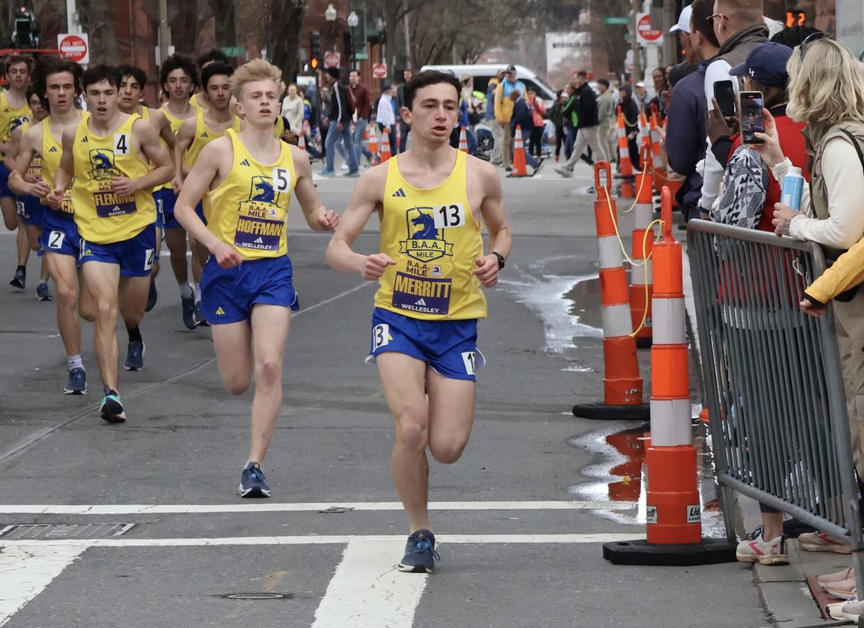 Wellesley's Eli Merritt leads the pack while taking the turn onto Boylston Street in the BAA Boys Invitational Mile on Saturday, April 13, 2024 in Boston. Behind him are Wellesley's Max Hoffman (No. 5) and Natick's Sean Fleming (No. 4).