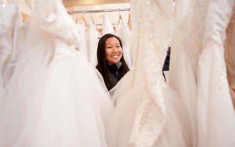 Bride shopping for a wedding dress - Credit: Rick Friedman