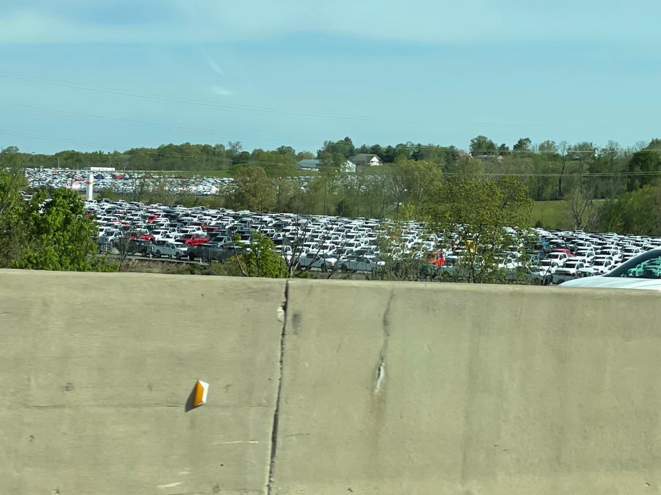 Thousands of pickup trucks could be seen from Interstate 71 in Sparta, Ky., on Sunday. Ford Motor Co. had approximately 22,000 vehicles at the end of March primarily in North America awaiting installation of chip-related components, Chief Financial Officer John Lawler said during a first-quarter earnings call with analysts on April 28, 2021.