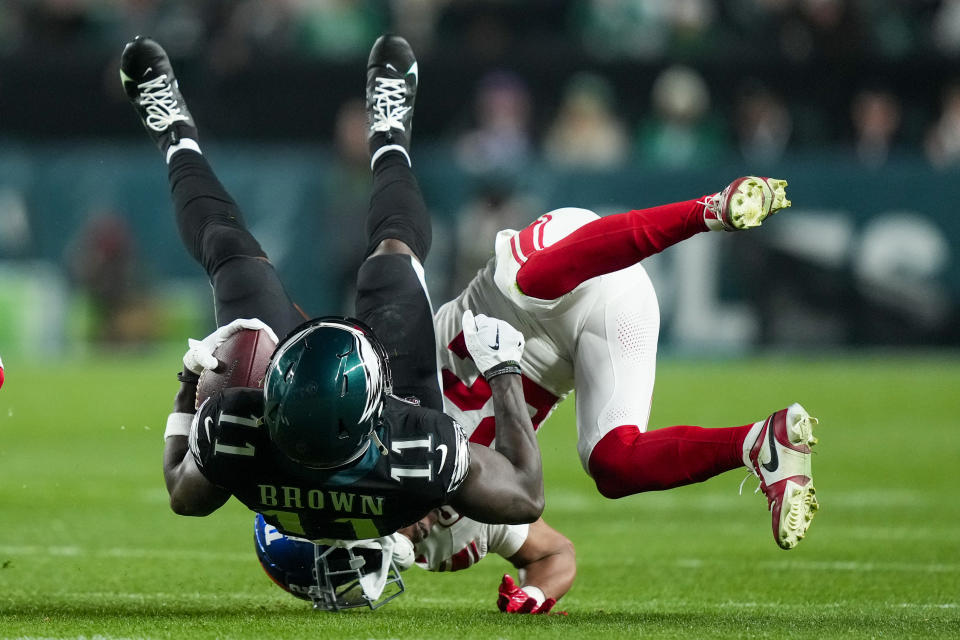 Philadelphia Eagles wide receiver A.J. Brown is tackled by New York Giants cornerback Adoree' Jackson during the second half of an NFL football game Monday, Dec. 25, 2023, in Philadelphia. (AP Photo/Matt Rourke)