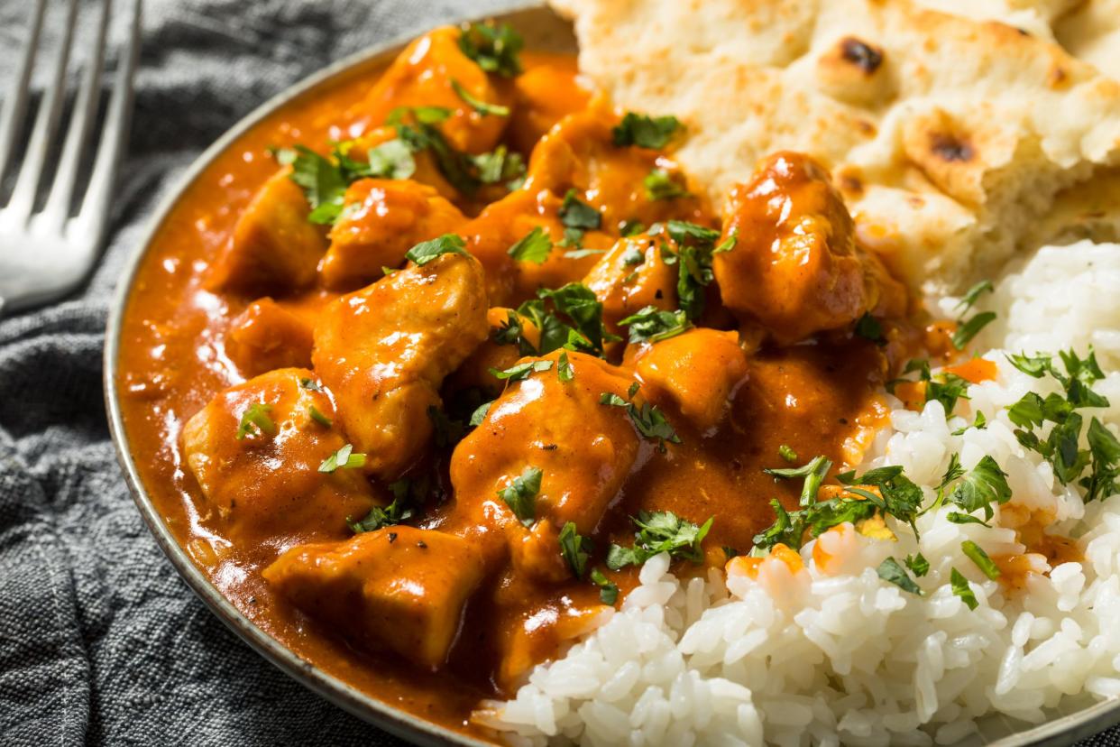 Homemade Indian Butter Chicken with Rice and Naan Bread