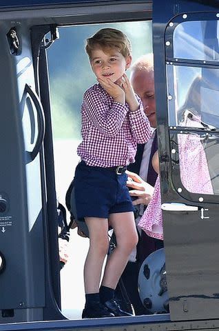 Samir Hussein/WireImage Prince George checks out a helicopter in Germany during a visit with his family in 2017.