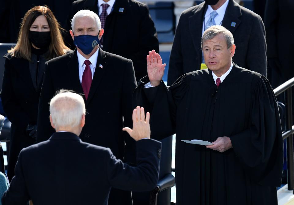 Mike Pence looks on as Joe Biden is sworn in as the 46th U.S. president