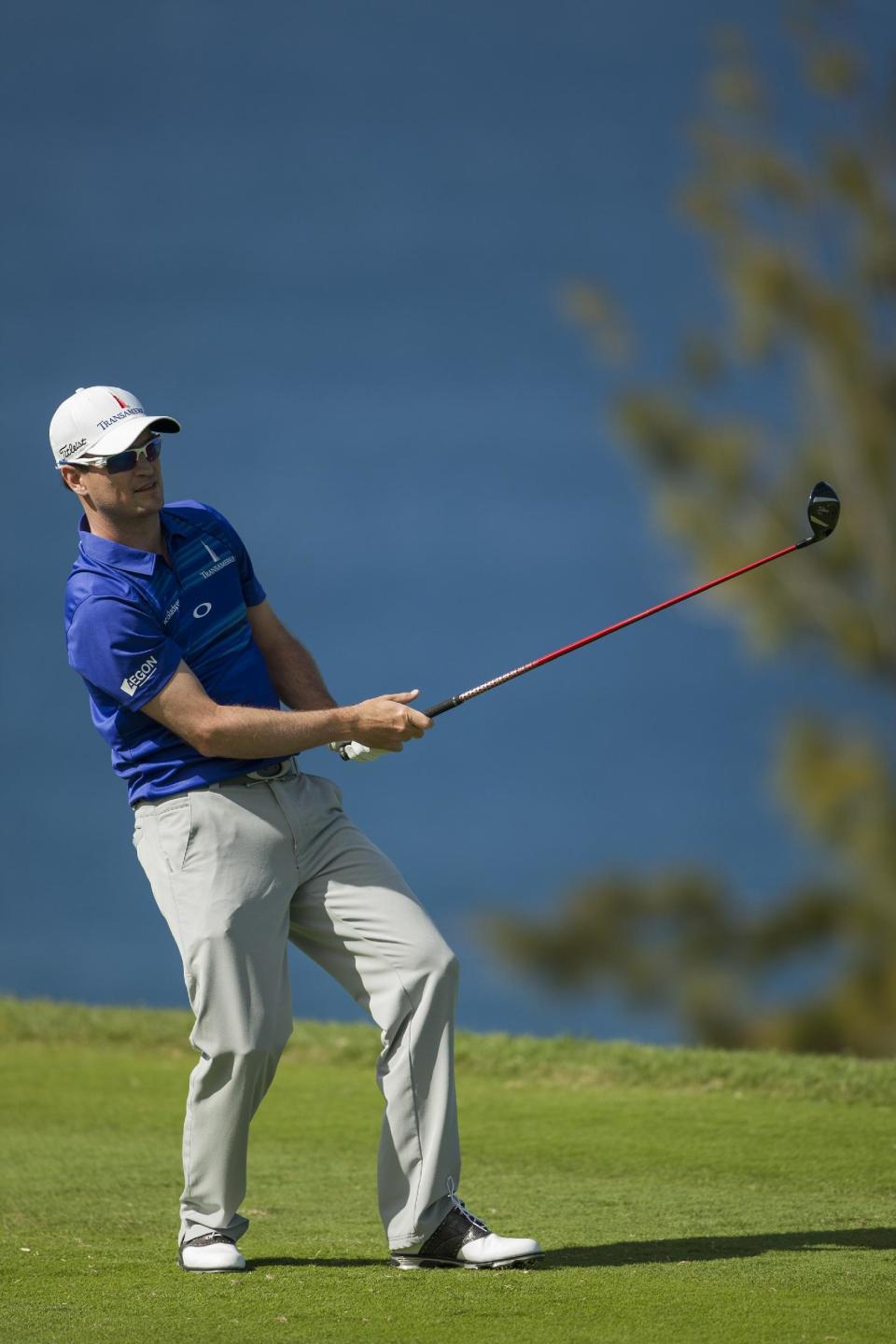 Zach Johnson reacts to his drive on the 13th green during the final round of the Tournament of Champions golf tournament, Monday, Jan. 6, 2014, in Kapalua, Hawaii. (AP Photo/Marco Garcia)