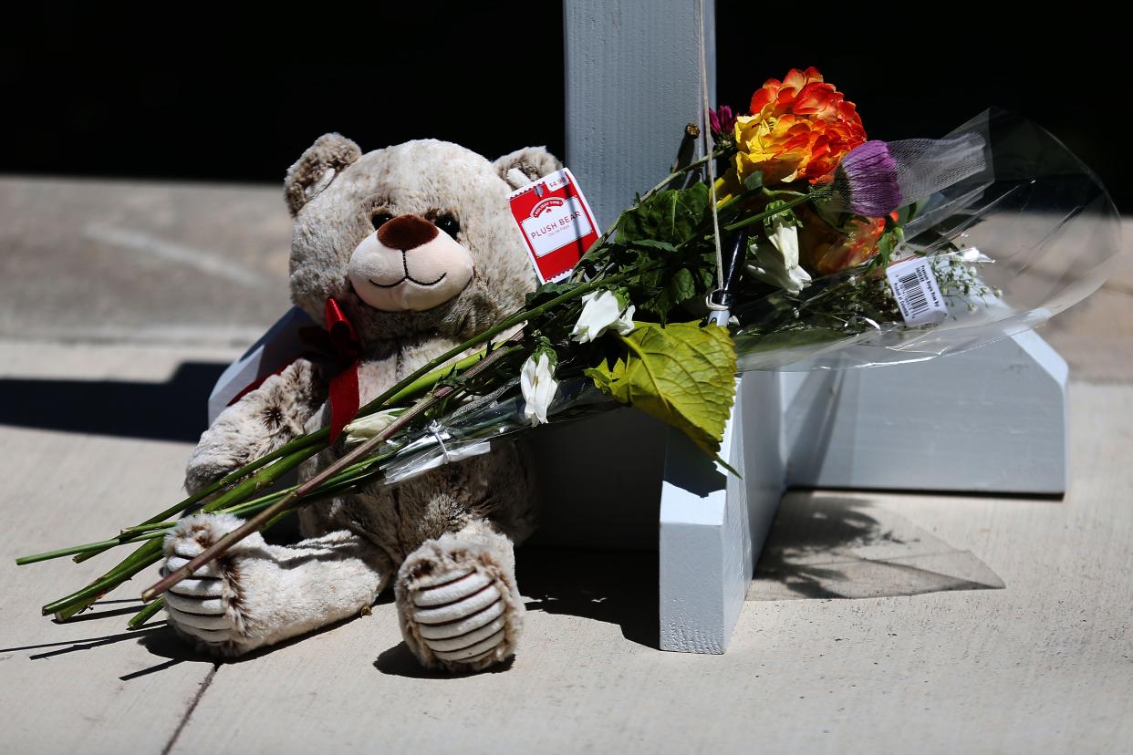 People in the Uvalde community pay their respects to the Robb Elementary School shooting victims May 26 at the City of Uvalde Town Square.