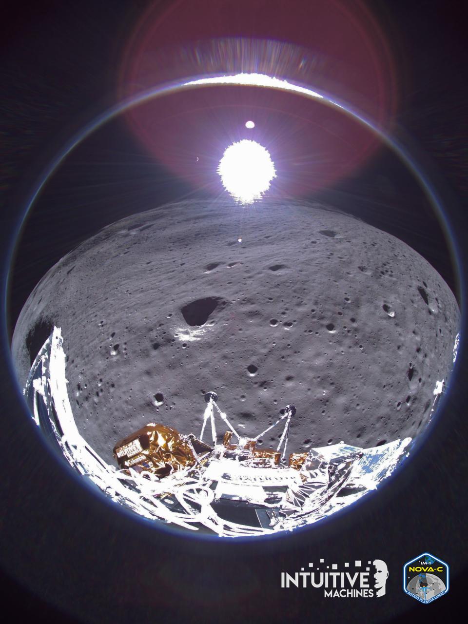 a silver and gold spacecraft can be seen at the bottom of a fisheye image of the moon's surface