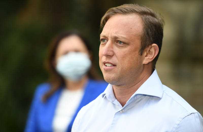 Queensland Deputy Premier Steven Miles is seen addressing the media during a press conference in Brisbane.