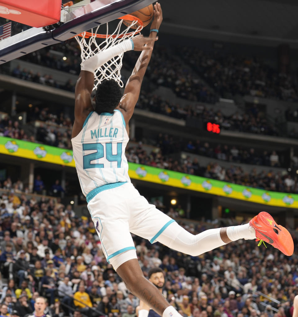 Charlotte Hornets forward Brandon Miller flies to the rim for a basket against the Denver Nuggets in the second half of an NBA basketball game Monday, Jan. 1, 2024, in Denver. (AP Photo/David Zalubowski)