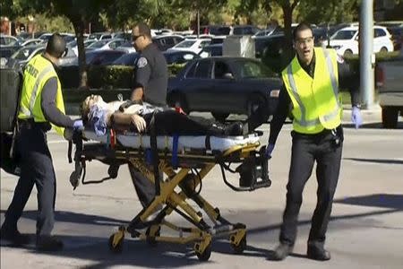 Rescue crews tend to the injured in the intersection outside the Inland Regional Center in San Bernardino, California in this still image taken from video December 2, 2015. REUTERS/NBCLA.com/Handout via Reuters