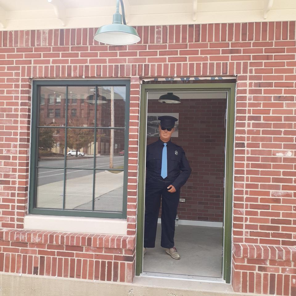 Earl the guard takes up his post in the rebuilt Studebaker guardhouse outside the former company's Building 113 on Lafayette Boulevard in South Bend.