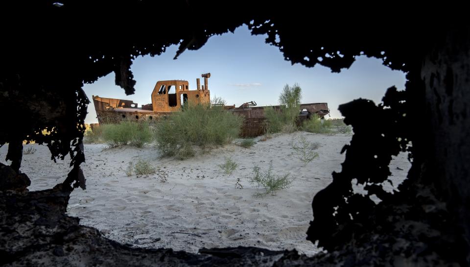 A boat sits where the Aral Sea once was in Muynak, Uzbekistan, July 12, 2023. Today, the Aral has shrunk to less than a quarter of its former size. (AP Photo/Ebrahim Noroozi)