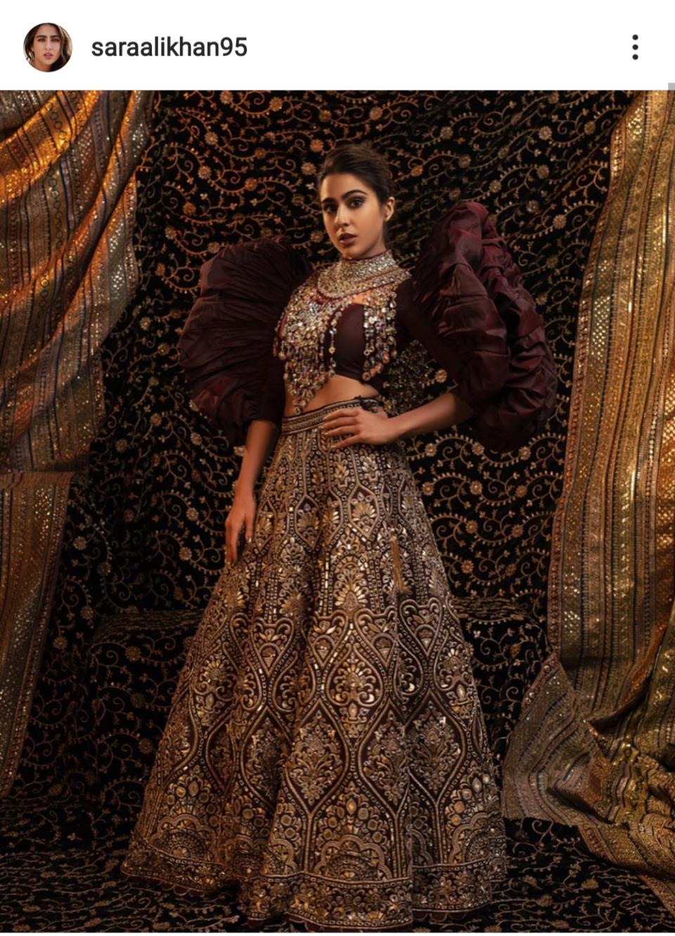 The Abu Jani-Sandeep Khosla ensemble was a breath-taking amalgam of powerful and pretty on the <em>Love Aaj Kal </em>actress. The burgundy and golden <em>lehenga </em>paired was paired with a solid blouse featuring dramatic sculptural puff-sleeves complete with a heavy jadau collar made for an utterly glamorous opening for the ace designer duo's show at the Blenders Pride Fashion Tour.