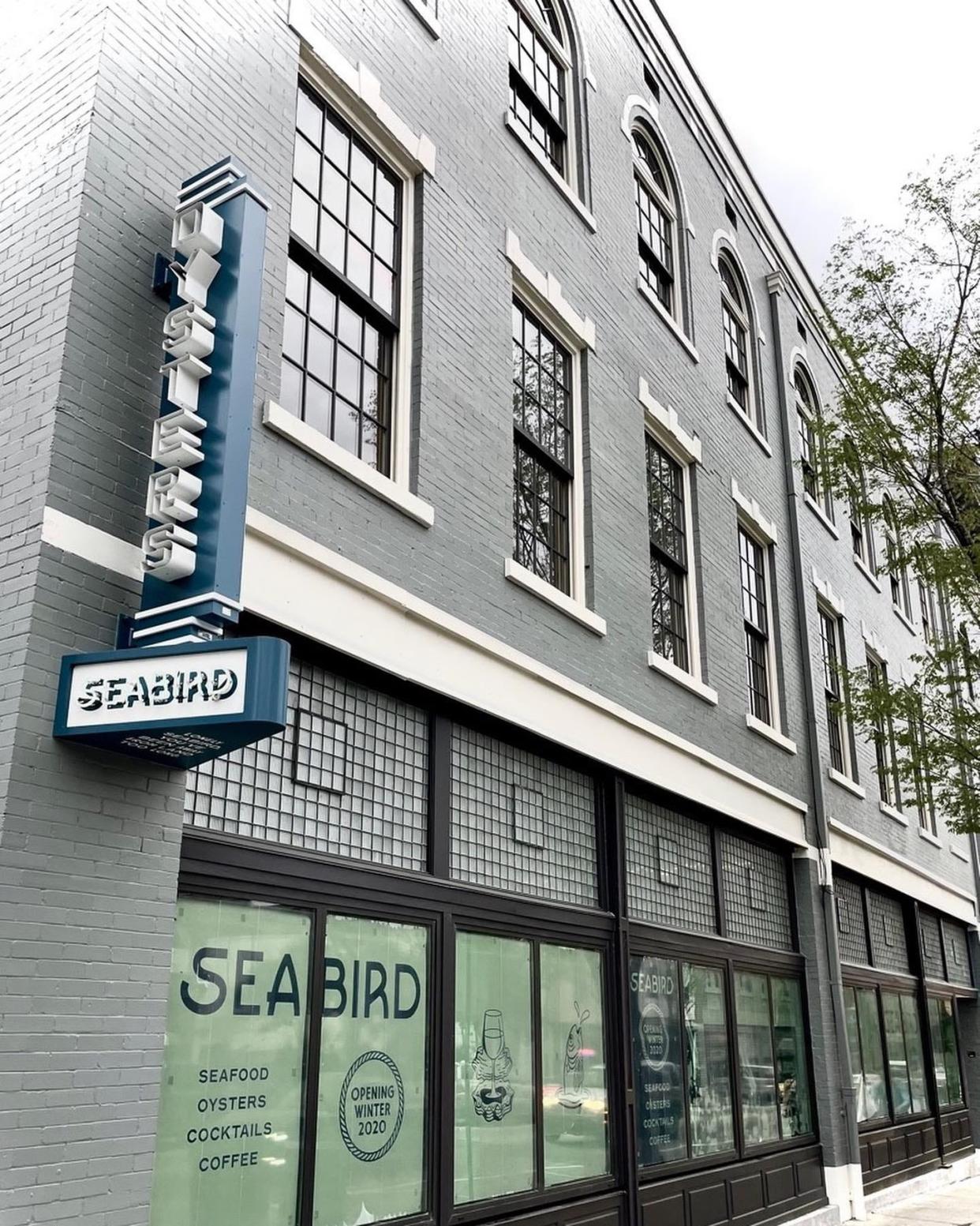 Exterior of the beautifully renovated historic building located at 1 S. Front St., now Seabird restaurant. In the renovation process, original window frames with rope and pulleys and woodwork dating back to 1899 were discovered and restored based on historic photographs and documentation.